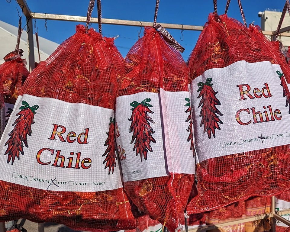 Multiple large sacks of dried Hatch, New Mexico red chile pods hanging up in Albuquerque