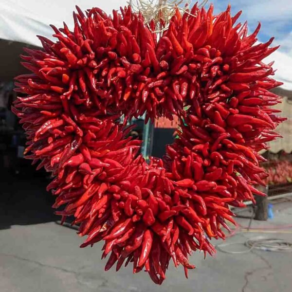 A chile ristra made into the shape of a heart with chile pequin at Farmers Chile Market in Albuquerque